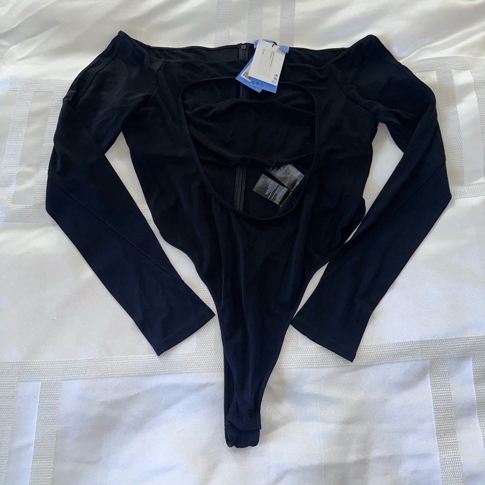Mugler x H&M collaboration black long sleeve cut out front thong bodysuit.